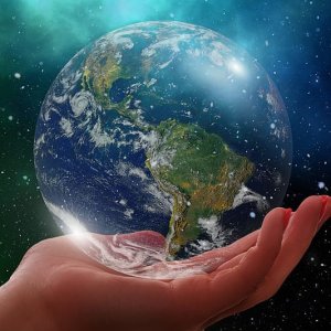 person-holding-blue-and-green-planet-earth